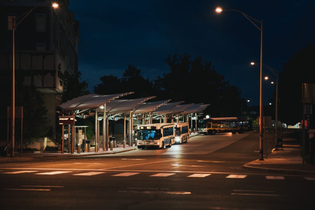 Photo of a bus station at night